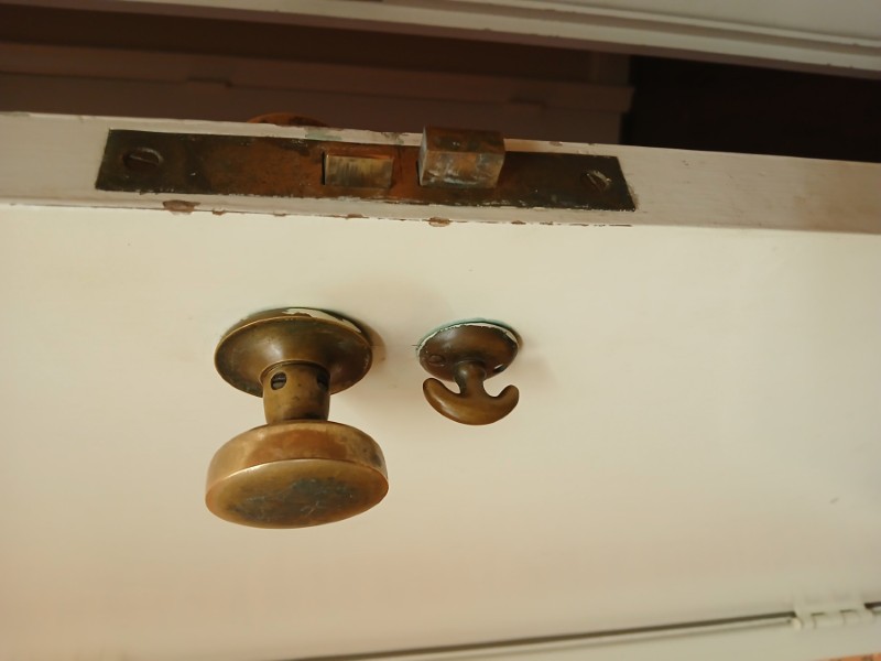 Antique strike plate and latch alignment